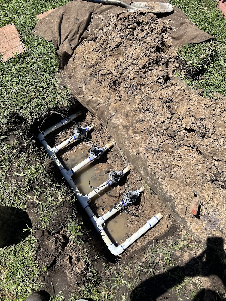 Valve manifold block installed in a trench